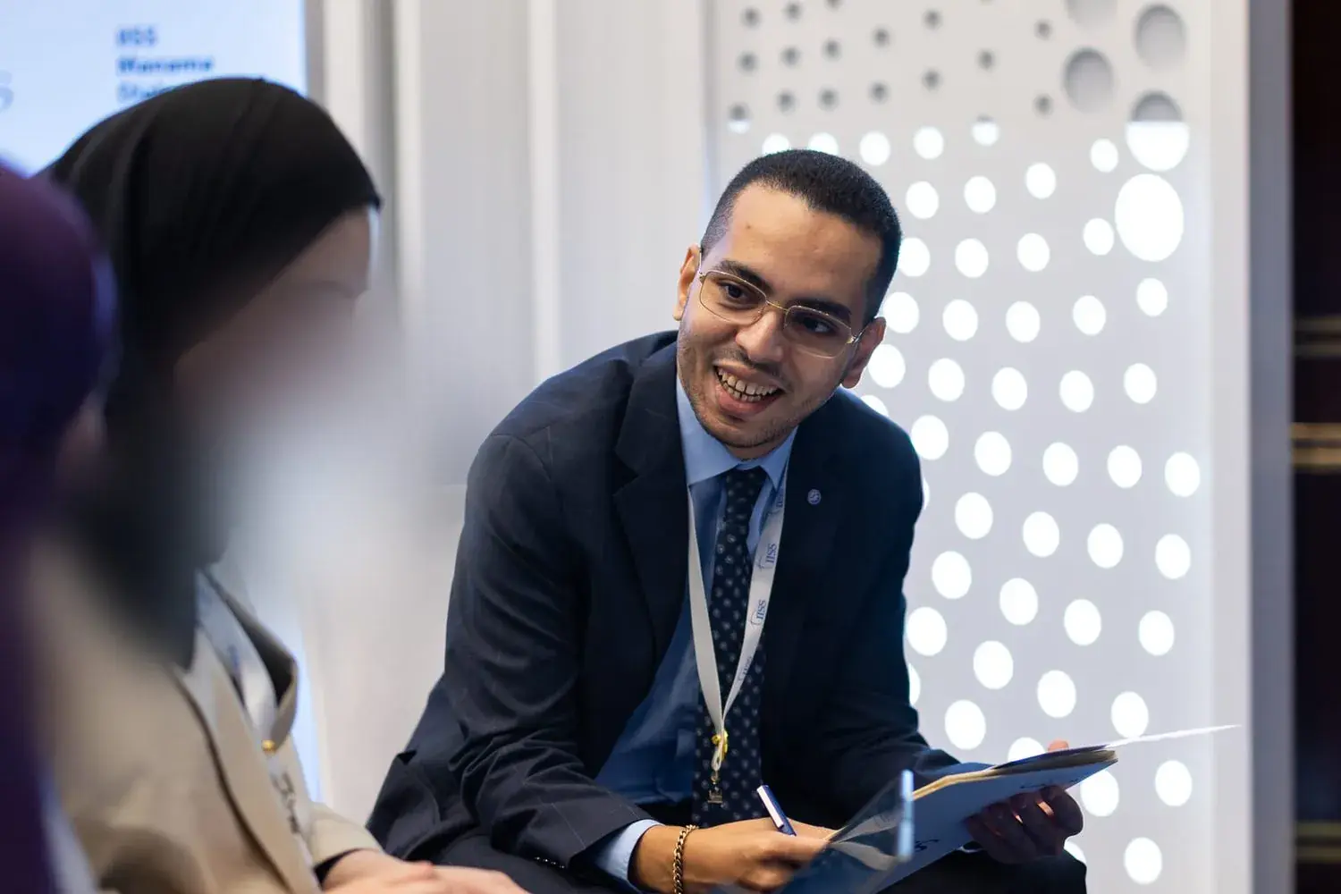 Delegates in conversation at a climate meeting